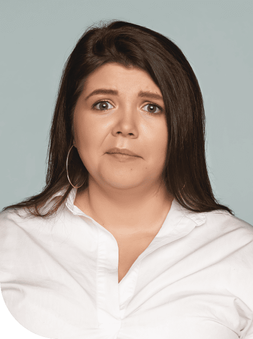 A woman with long hair wearing a white shirt.